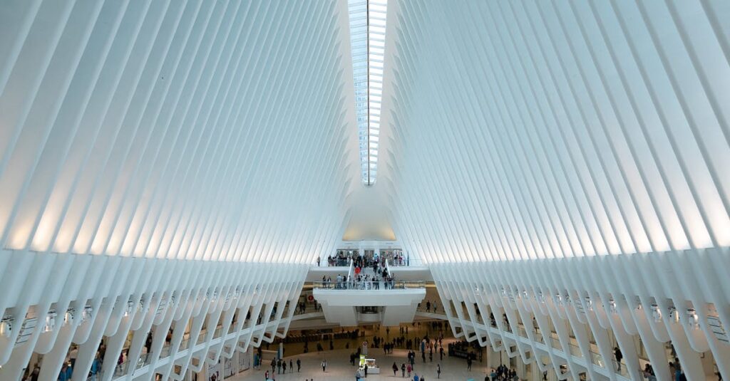 Modern architectural view of the Oculus in NYC, showcasing its futuristic design and bustling interior.